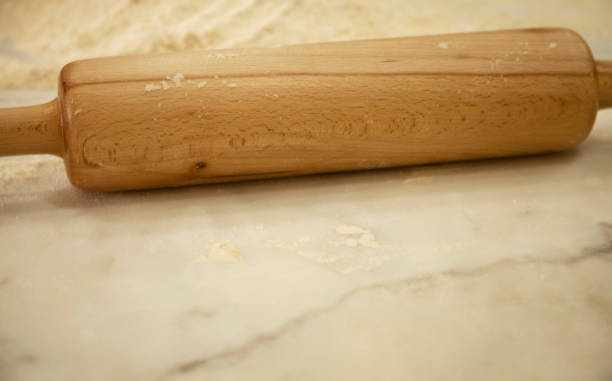 istock Rolling pin and flour on the kitchen counter 1289910578