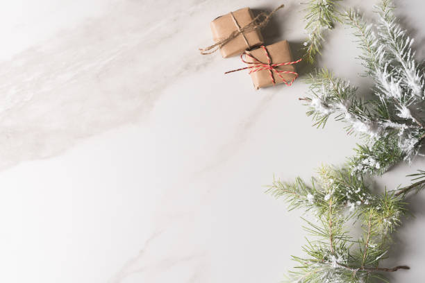 istock Christmas background with gift boxes, red ribbon, winter decorations, isolated on white background. 1289911220