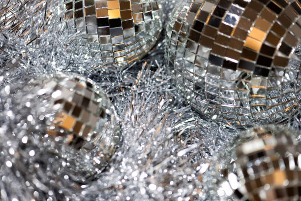 istock Christmas background with silver tinsel and mirror disco balls 1289911349