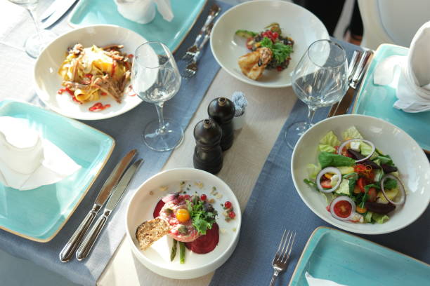 istock Delicious dishes on table at restaurant. 1289911462