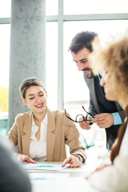 istock Group of business people discussing inside modern office 1289912586