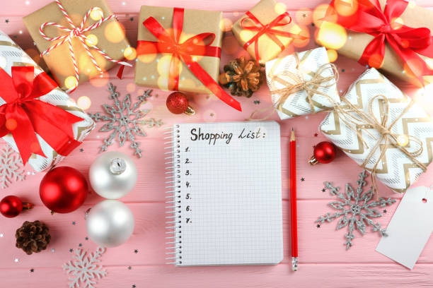 istock Beautiful Christmas or New Year background with place for text on colored background top view with golden bokeh. 1289914083