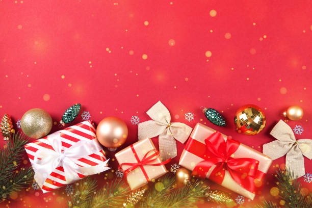 istock Beautiful Christmas or New Year background with place for text on colored background top view with golden bokeh. 1289915147
