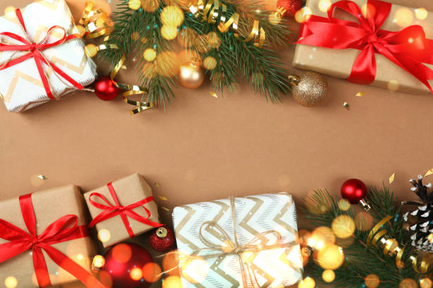 istock Beautiful Christmas or New Year background with place for text on colored background top view with golden bokeh. 1289915171