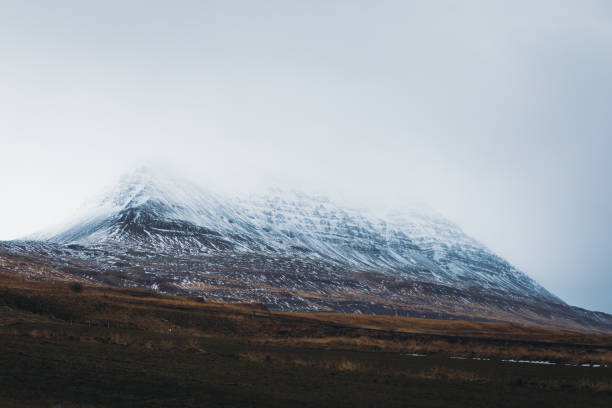 istock Dramatic view of snowcapped mountain peaks in Iceland 1289915282