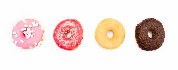 istock Four delicious round sweets on white background 1289917857