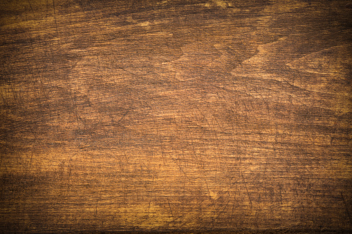 wooden warm background with a vignette in the rustic cowboy style of the wild West.