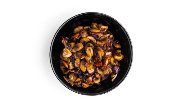 istock Fried mushrooms with onions on a white background 1289919274