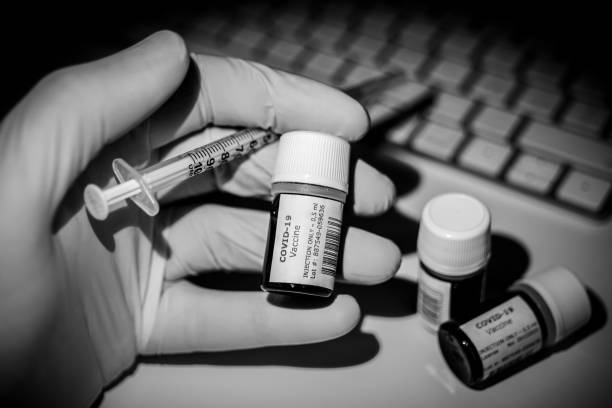 istock A creative image of some Covid-19 Vaccine bottles ready to be injected 1289919347