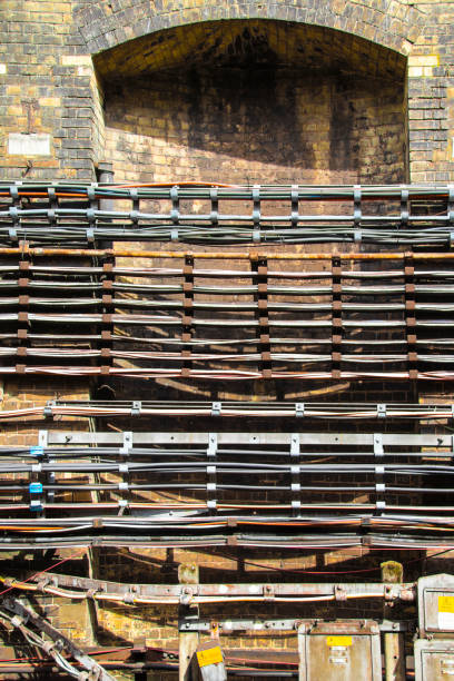 istock Cables fastened along wall underground in London subway 1289921310