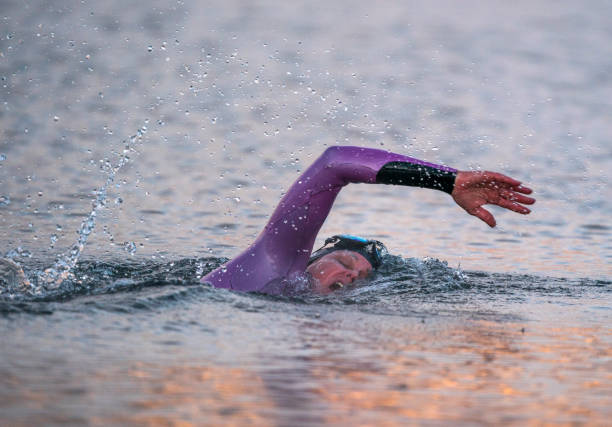 istock Swimmer braves icy waters. 1289921989