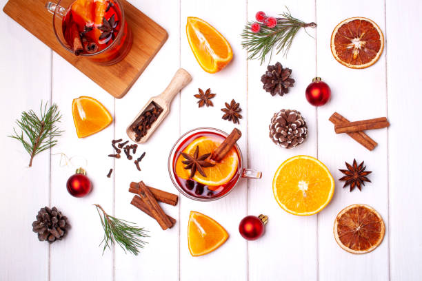 istock Cooking mulled wine on a white background. Flat lay style. Christmas and New Year drinks. Winter holidays 1289922077