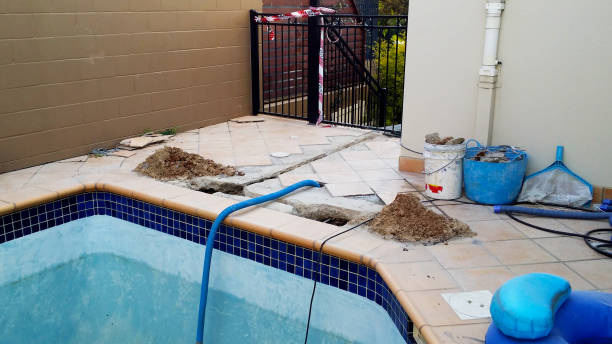 istock Swimming pool under repair with danger tape 1289922541
