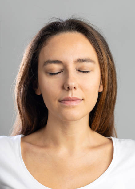 istock Young woman with calm facial expression 1289925027