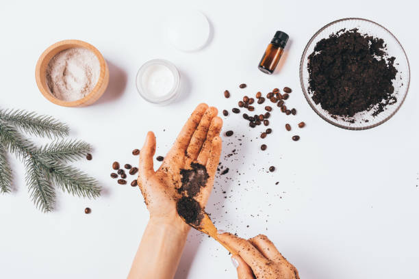istock Woman applying coffee scrub on her hands 1289926353