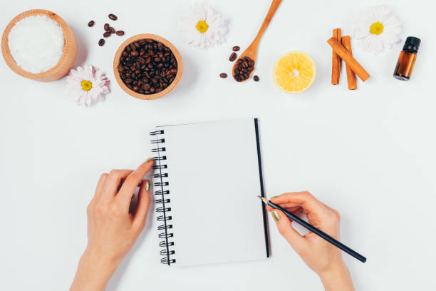 istock Woman's hands writing in empty notepad next to natural organic ingredients 1289926360