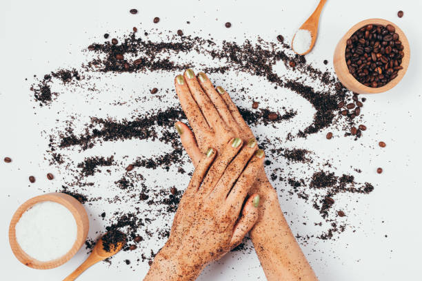 istock Female hands apply fresh natural coffee body scrub 1289926380