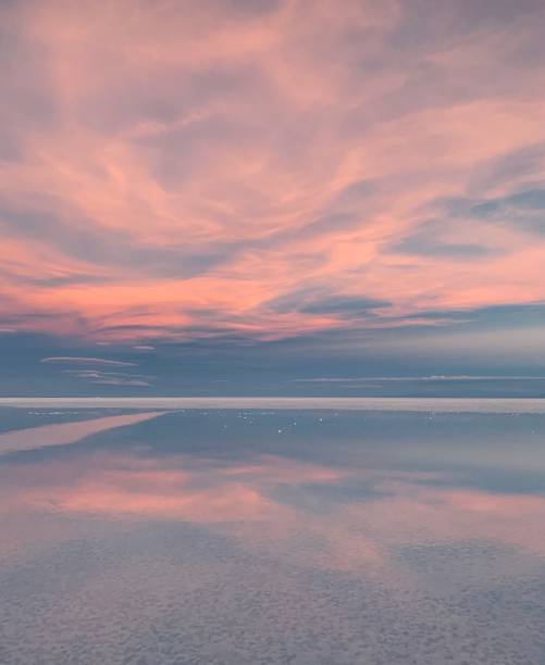 istock sunset sky clouds pink blue color, magic sun setting over tranquil sea, natural wonder, space landscape. 1289926529