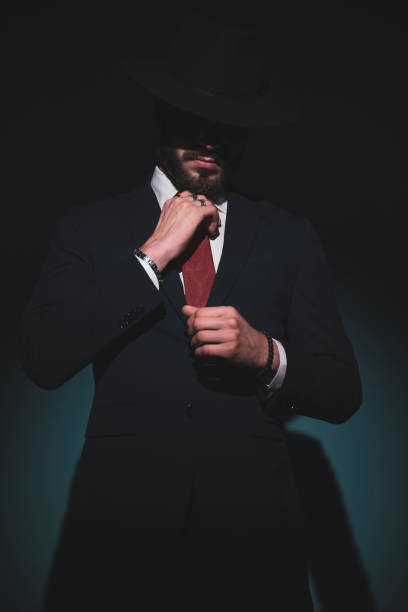 istock attractive businessman arranging himself, being mysterious 1289928198