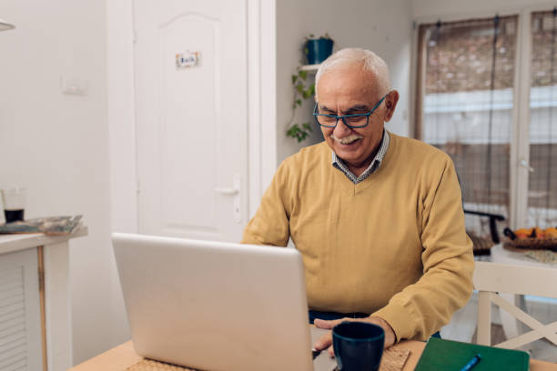 istock Senior man working from his house 1289929070