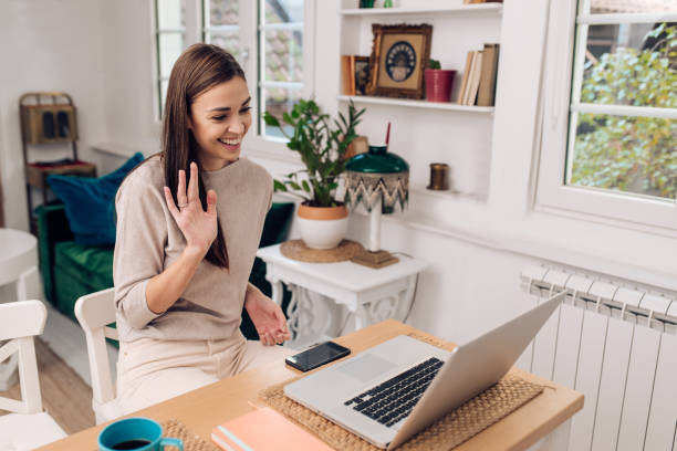 istock Young woman working with her online business partners 1289929103