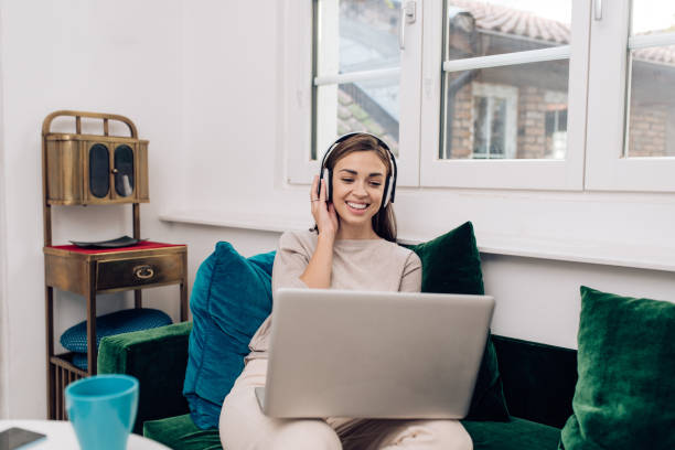 istock Young woman freelancing from the cozy sofa 1289929131