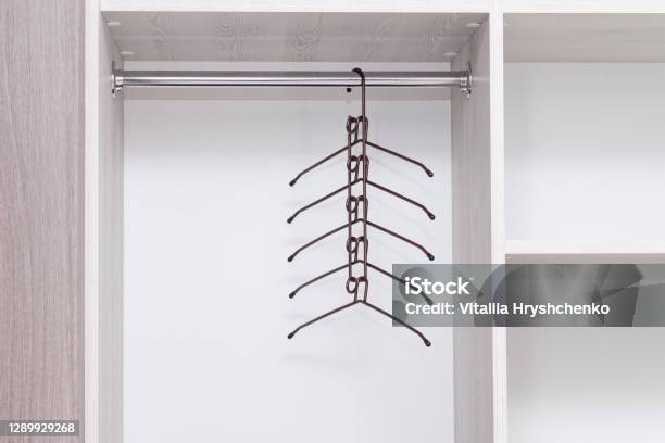Empty Metal Multifunctional Clothes Hanger In Empty Wardrobe Stock Photo - Download Image Now