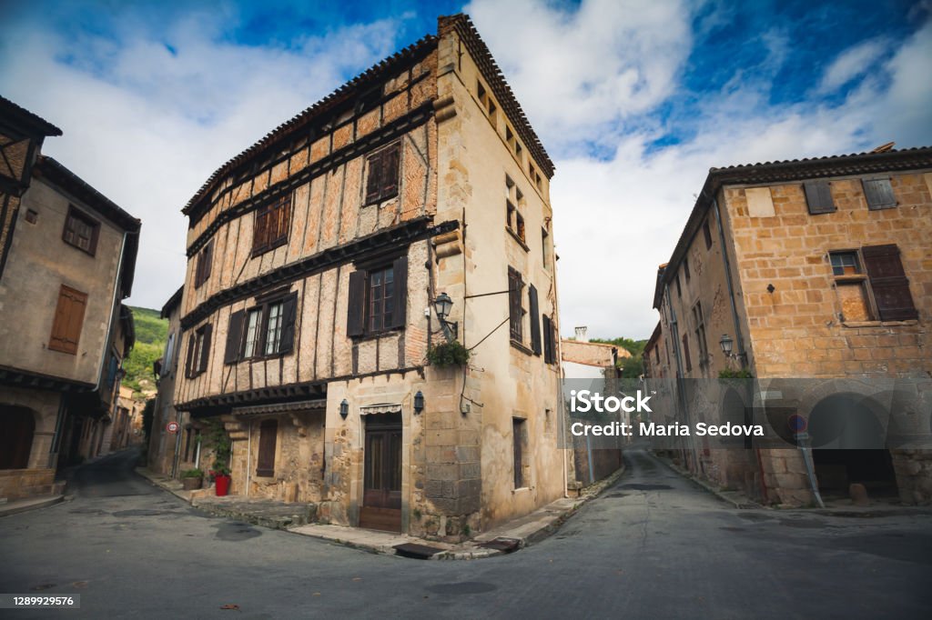 Traditional medieval half-timbered buildings in the main square of Alet-les-Bains, a French town Aude Stock Photo