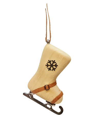 Cute wooden toy boot skates isolated on white