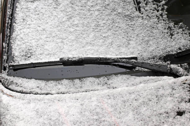 istock Snow and ice on the windshield of a car 1289931275