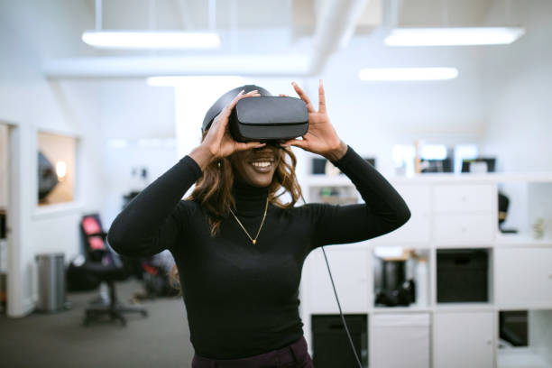 istock Woman Working In Office With VR Headset 1289931489