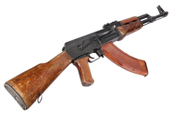 Rare first model AK - 47 assault rifle with a milled receiver Rare first model AK - 47 assault rifle with a milled receiver isolated on white ak 47 violence industry black stock pictures, royalty-free photos & images