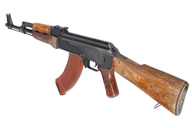 Rare first model AK - 47 assault rifle with a milled receiver Rare first model AK - 47 assault rifle with a milled receiver isolated on white ak 47 violence industry black stock pictures, royalty-free photos & images