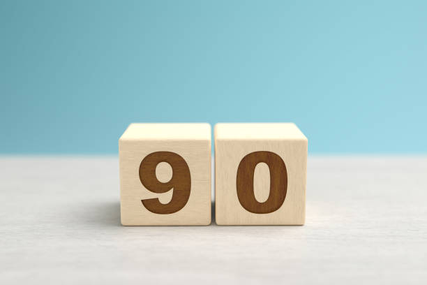 istock Wooden toy blocks forming the number 90. 1289934484
