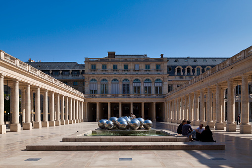 Paris, France - September 21 2020: The Galerie d'Orléans at the Palais Royal with its fountains by Pol Bury is surrounded by the Galerie du Jardin to the north, the Galerie des Proues to the east, the Galerie de la Cour-d'Honneur to the south and the Galerie de Chartres West.