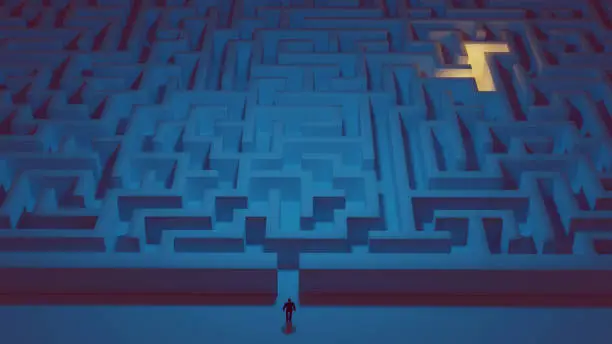 Photo of Man stands in front of a big maze ready to take on the challenge