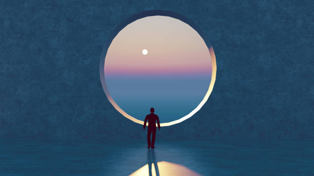 istock Man looks at a scenic view through big circle window 1289937802