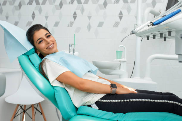 Overview of dental caries prevention.Woman at the dentist's chair during a dental procedure. Beautiful Woman smile close up. Healthy Smile. Beautiful Female Smile stock photo