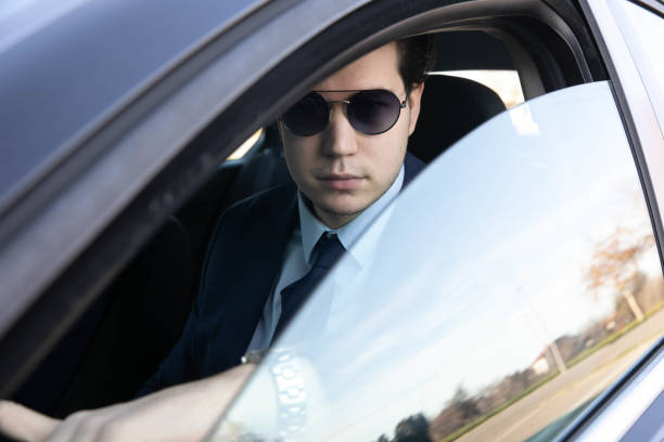 istock Businessman Driving Car 1289940504