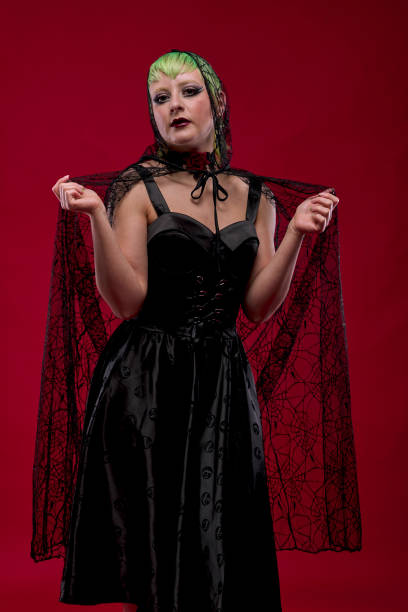 istock Woman dressed in gothic clothes, scary halloween 1289941022