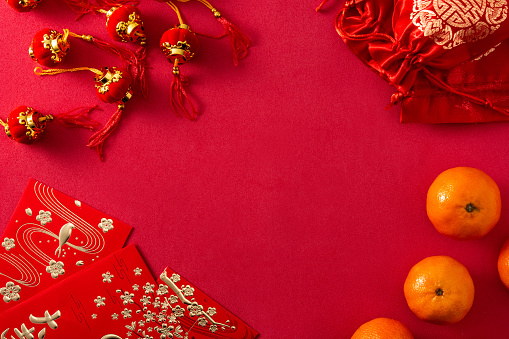 Chinese new year festival decorations and oranges on red background