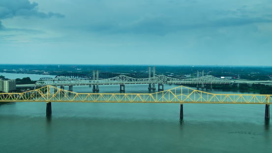 Aerial shot of the Ohio River winding its way between Louisville, Kentucky and Clarksville, Indiana on a summer evening.