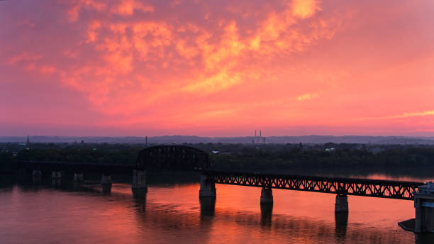 istock Beautiful Sunset on the Ohio River - Aerial 1289941124