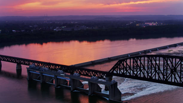 istock Sun Setting Over the Falls of the Ohio River - Drone Shot 1289941133