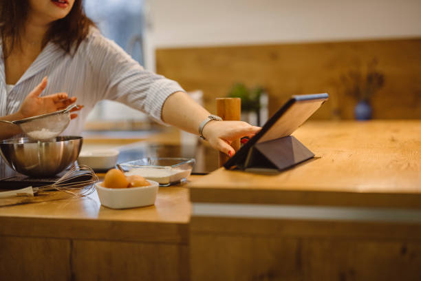 istock Baking cookies and following the recipe on a digital tablet 1289944745