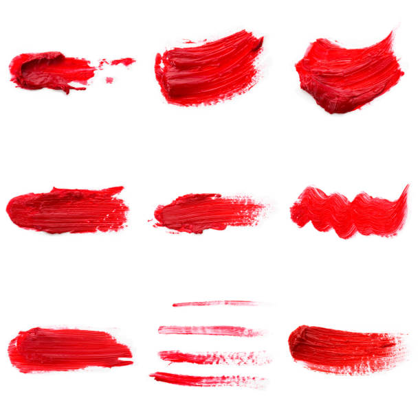 istock Lipstick smear smudge swatch isolated on white background. Cream makeup texture. Bright red color cosmetic product brush stroke swipe sample 1289948370