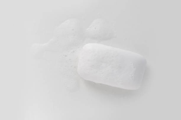 istock Soap bar and foam on white background, top view. Mockup for design 1289948393