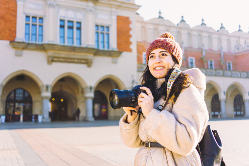 Young Woman with camera in Krakow, Poland