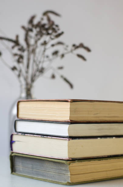 istock A stack of books on a table on a white background. I love reading 1289949292
