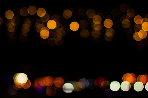 golden illumination lights abstract garland lamps bokeh effect on black empty copy space for your trext here